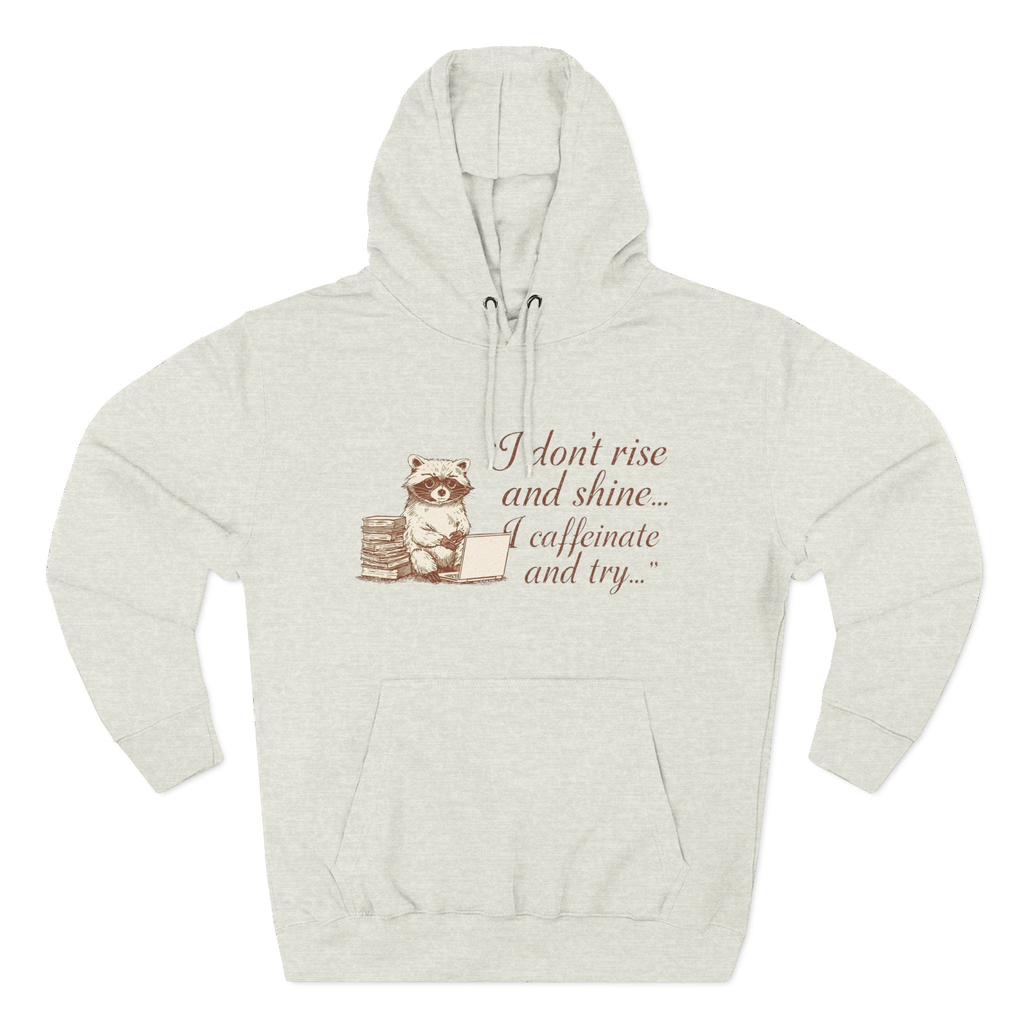 Cozy Raccoon Coffee Hoodie — "I don't rise and shine... I caffeinate and try" Fleece Pullover