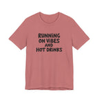 T‑Shirt — "Running on Vibes and Hot Drinks" Graphic Tee
