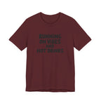 T‑Shirt — "Running on Vibes and Hot Drinks" Graphic Tee